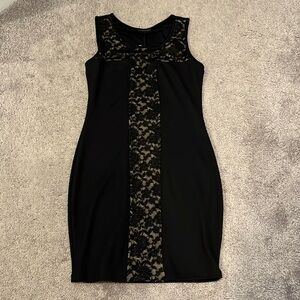 Black form fitting dress. Never worn. NWT.